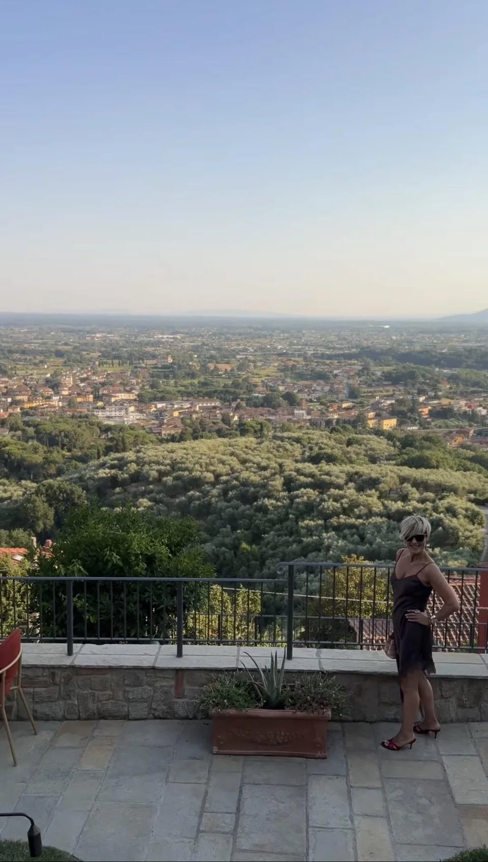 Rita in the Tuscan landscape above the olive groves.